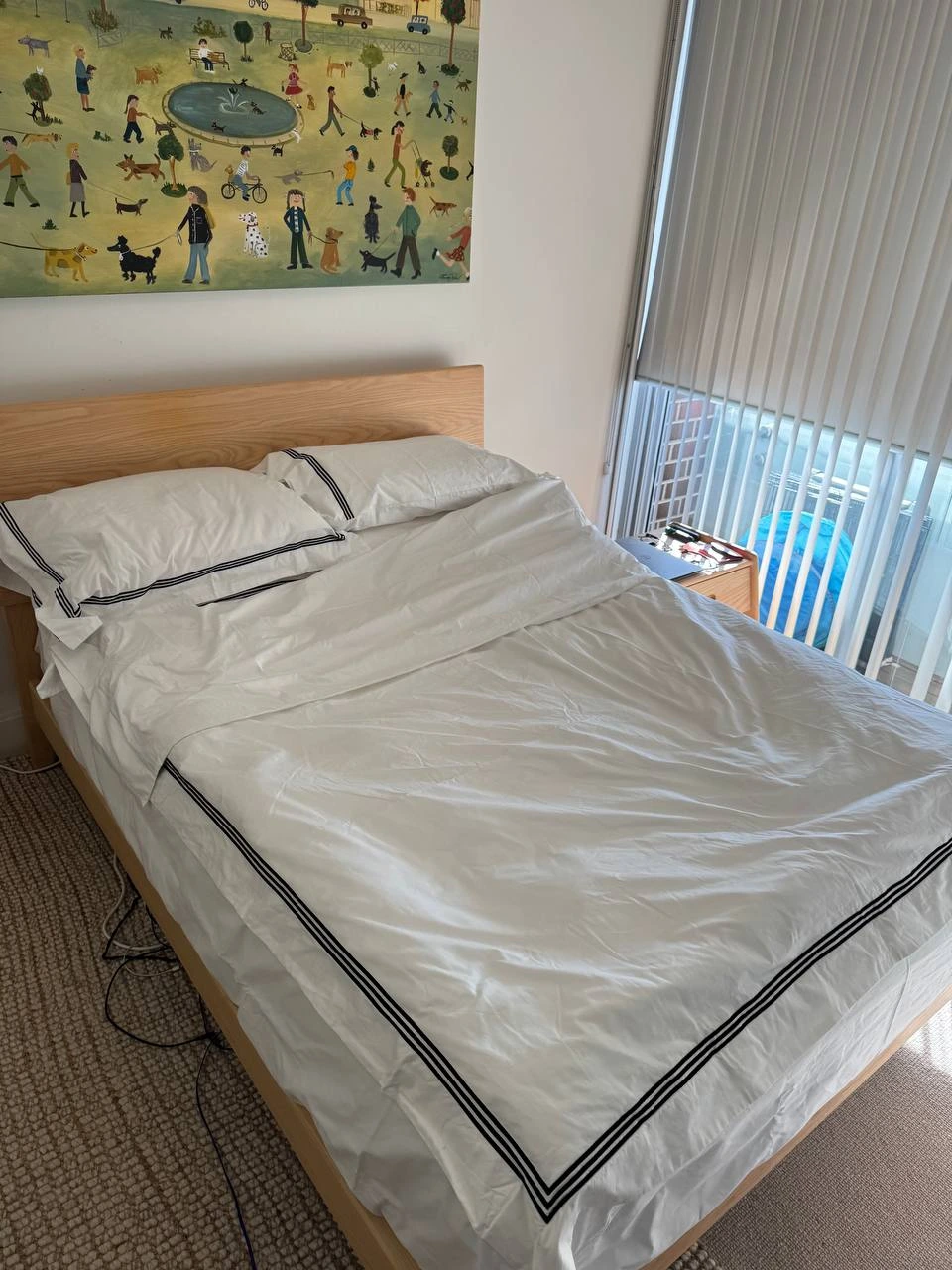 After professional bed making service with neatly arranged bed, fresh linens, fluffed pillows, and a clean tidy bedroom. — after
