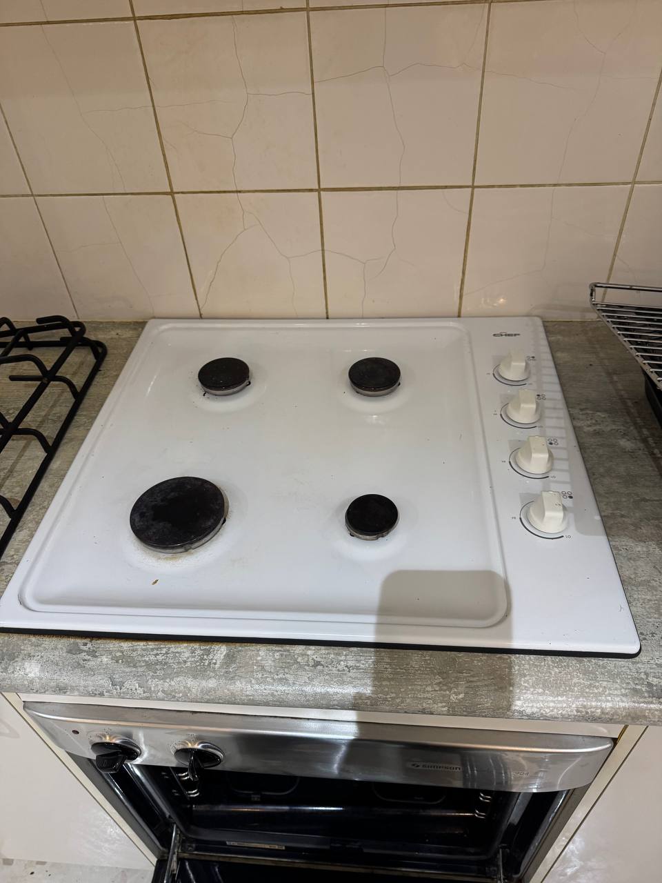 Sparkling clean gas cooktop and burners after professional deep clean service — after