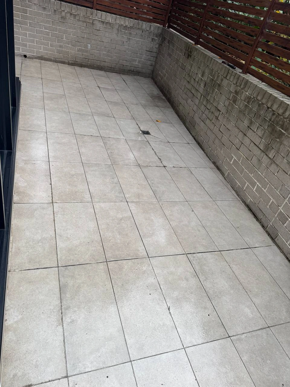 Clean pressure washed courtyard tiles after bond clean — after