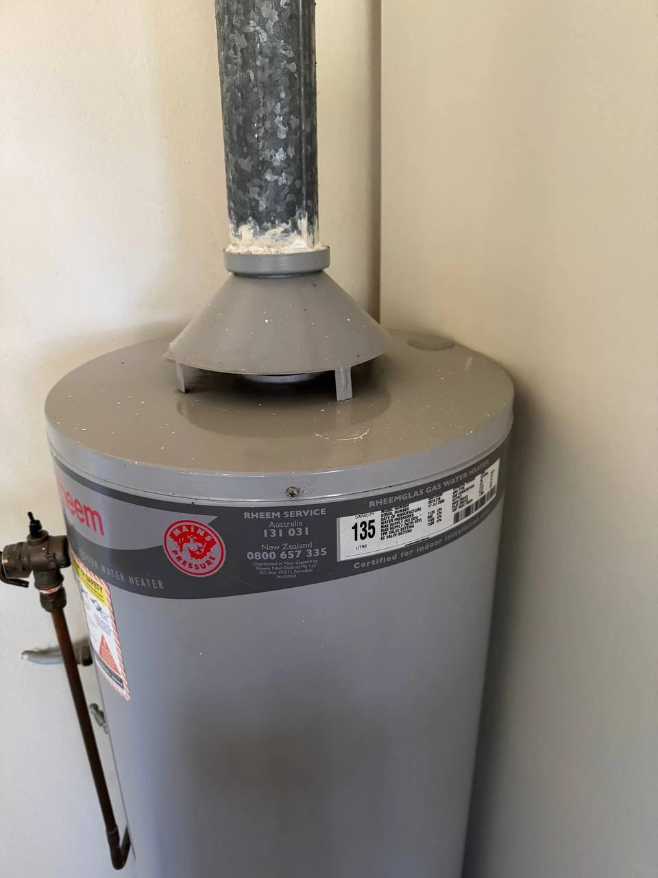 Clean gas hot water system with dust removed after professional service — after